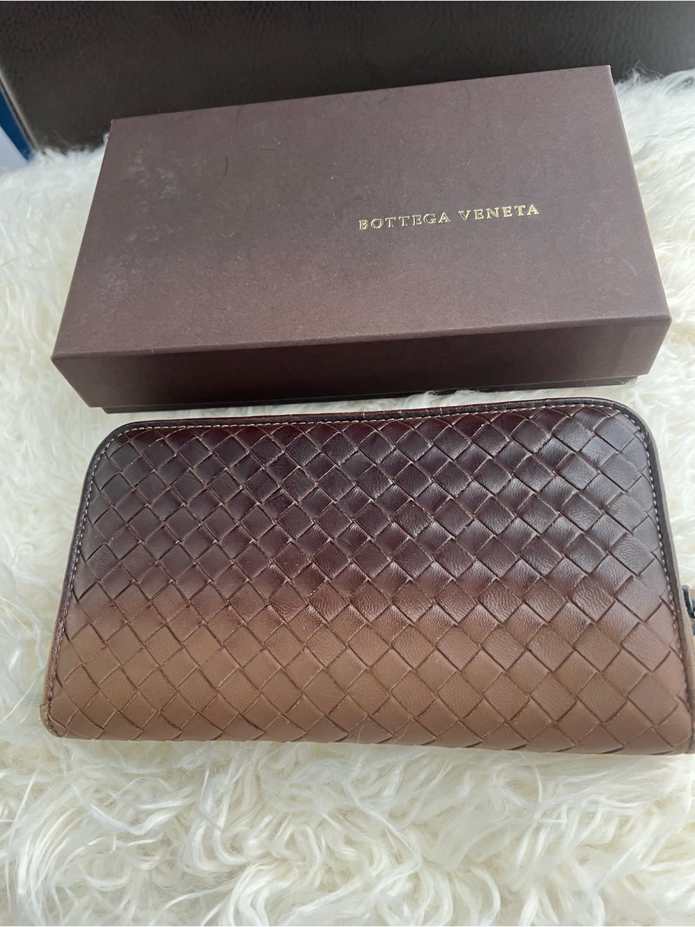 Bottega Veneta Intrecciato woven leather zip-around long wallet.